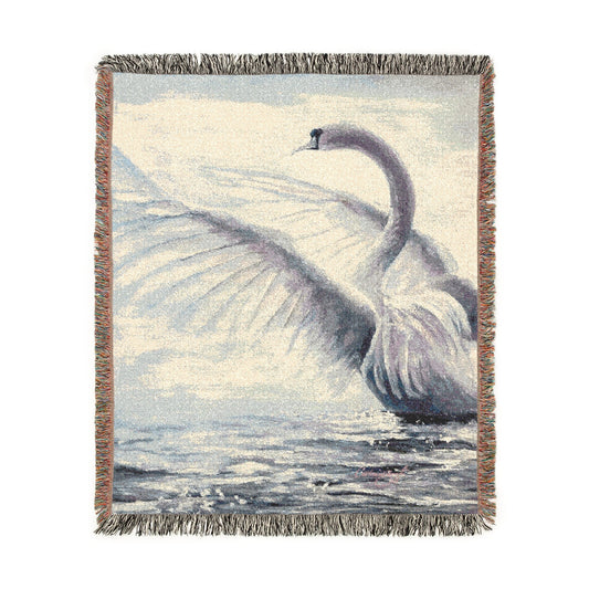 Swan Serenade cotton woven art throw featuring a graceful swan spreading its wings over shimmering water. Size 50x60 inches